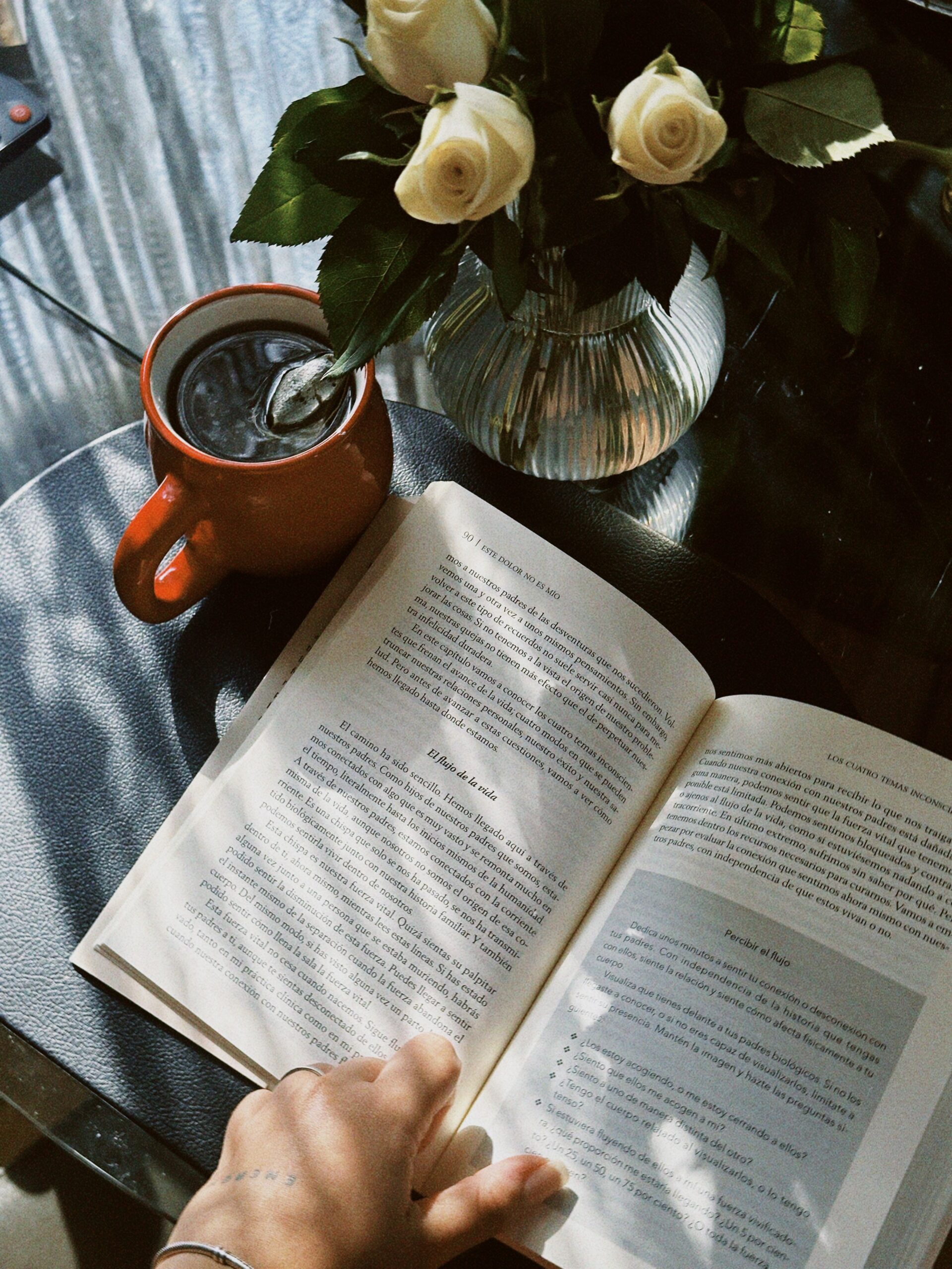 book and coffee cup on a table