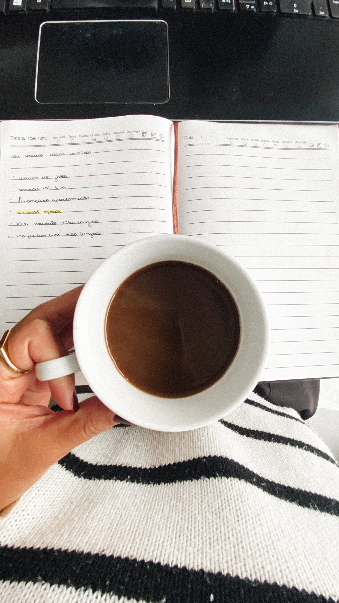 coffee cup over a notebook