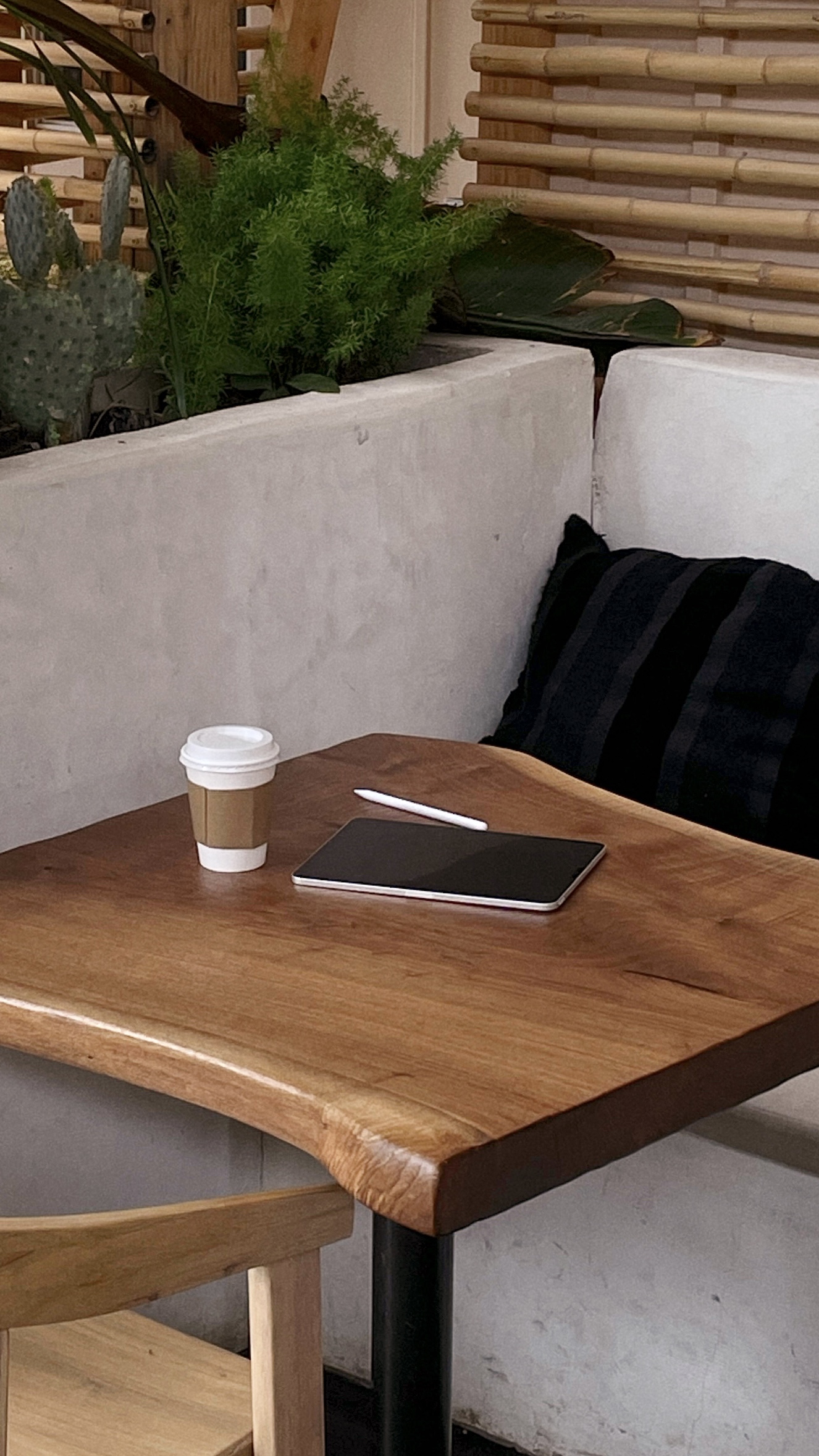 coffee and a notebook sitting on a table